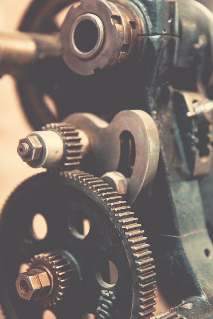 services-01 Detailed view of vintage industrial machinery gears showcasing precision engineering.